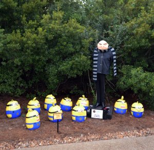 The minions from Despicable Me is a popular scarecrow subject at festivals since they're easy to make. Still, I bet the guy who did this took great advantage of early pumpkin sales and paint.