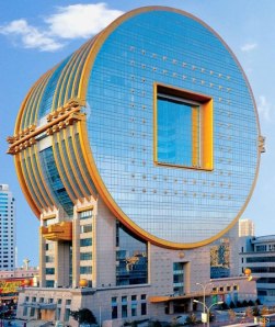 Whether a giant microchip, subway token, power generator, or whatever the hell it is, this building seems to be China's burgeoning capitalism, innovation, and a bad taste for architecture.