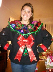 I'm sure this woman took a lot of time to make this sweater as she stands as if she's proud of what she accomplished. Still, I love the wreath though.