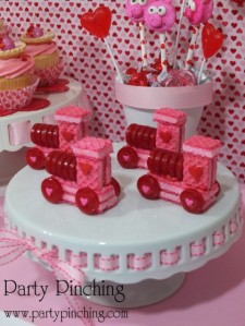 Now these sweet candy/cookie trains are adorable and would make wonderful treats for a child's school V-Day bash. Man, what you can do with pink cookies and life savers.