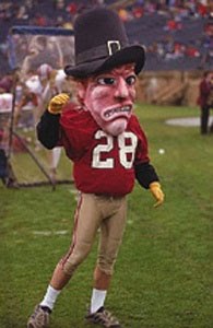 So this gives me an impression that John Harvard was present at the first Thanksgiving, died of some 17th century plague or was executed for witchcraft, and rose out of his grave as a zombie. Still, you'd think a prestigious rich kid school like Harvard would have a better mascot than this.