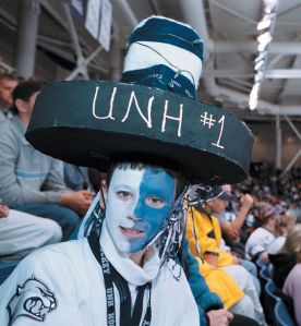 Doesn't hurt that he's wearing a puck hat to boot. Also he painted his face white and light blue.