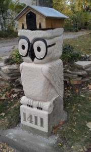 Well, the mailbox is on the owl statue. But it seems to be a quite clever design nonetheless. Love the owl glasses.