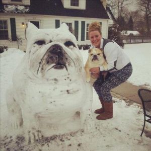 Unfortunately, her special four legged friend doesn't seem too amused by her snow dog creation. Still, it's a work of genius.