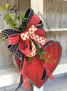 Well, this is a lovely decoration for V-Day. Love the bow. Not sure about the foliage.